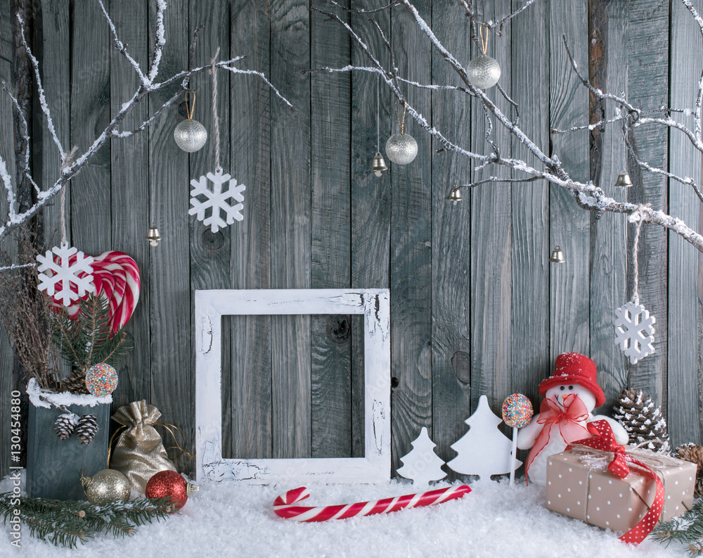 Obraz premium Christmas interior with snowman, photo frame, decorative branche