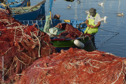 Fisherman mending nets, Alghero, Sardinia