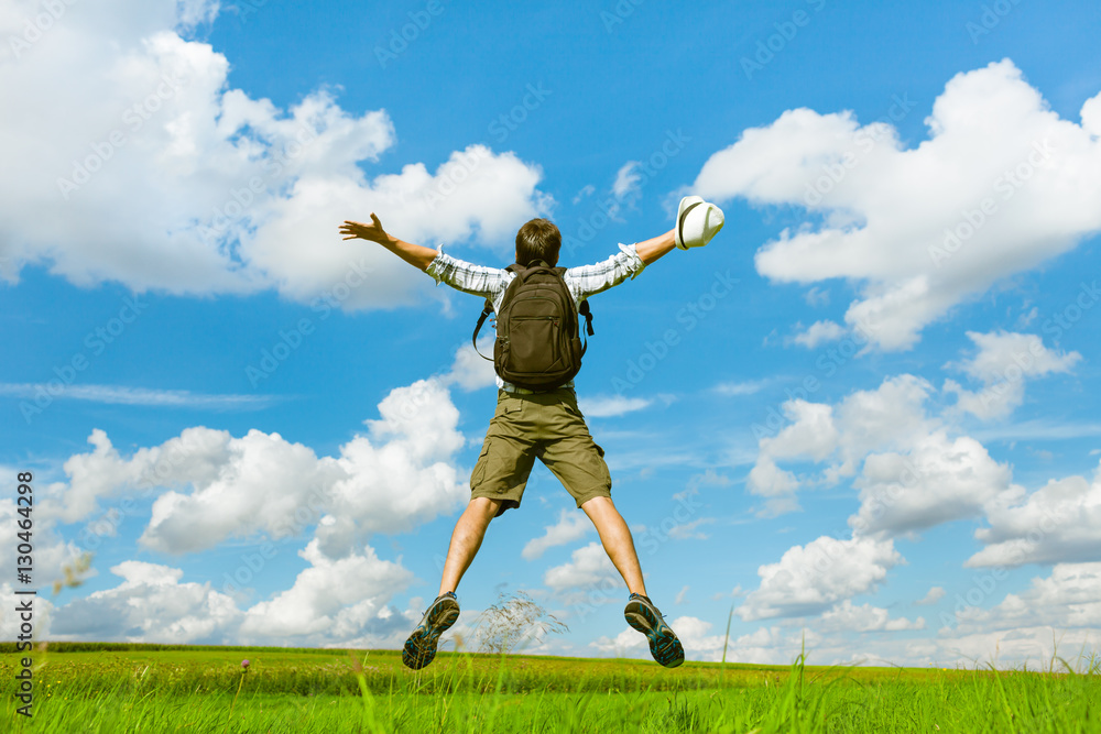 Happy male traveler outdoors jumping for joy. Happy male traveler outdoors jumping for joy.