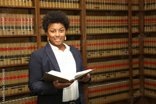 Portrait of an attractive African American female lawyer in law library
