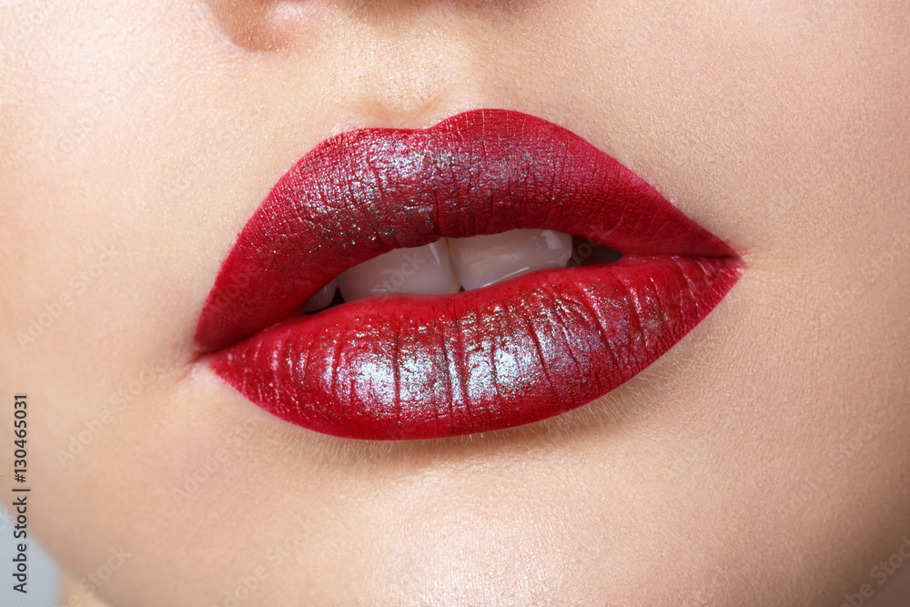 Beautiful female with red shiny lips closeup,macro photography Beautiful female with red shiny lips closeup,macro photography