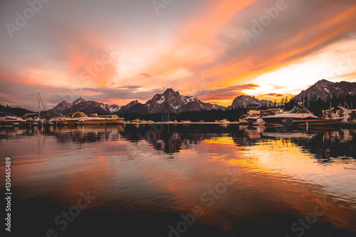 boats docked on Lake Jackson near the Grand Teton range in Wyoming