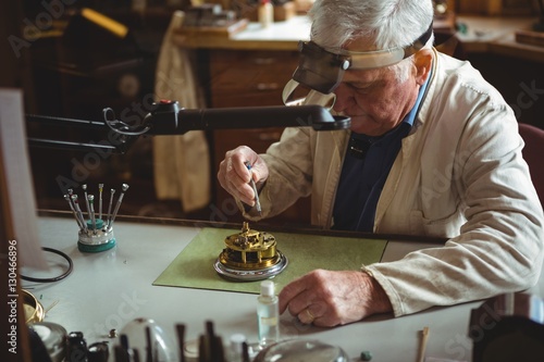 Foto Horologist repairing a watch