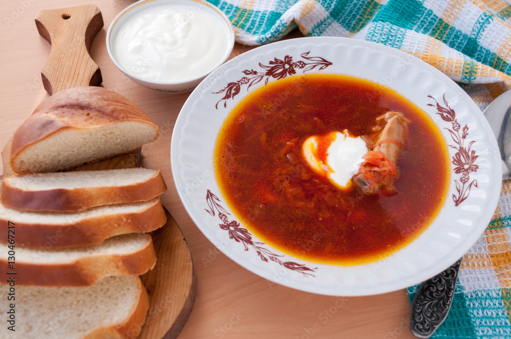 For lunch, borscht with sour cream and white bread For lunch, borscht with sour cream and white bread