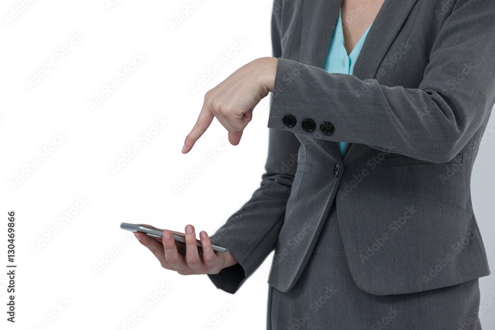 Mid section of businesswoman using mobile phone Mid section of businesswoman using mobile phone