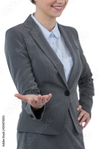 Businesswoman gesturing against white background