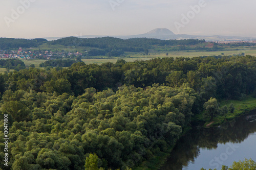 View from hill to solitary mountain in the distance