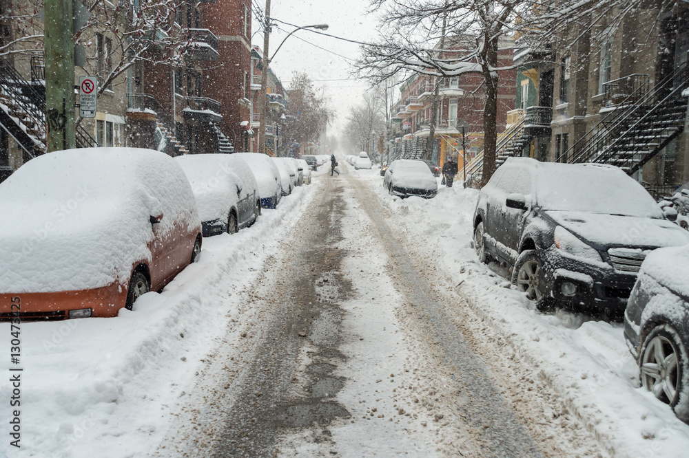 Fototapeta premium Cars covered in snow during snowstorm in Montreal, December 2016