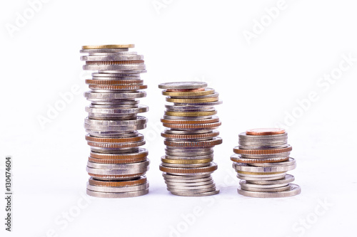 growing money graph on a three row of coin and pile of bath coins stack  on white background finance business isolated
