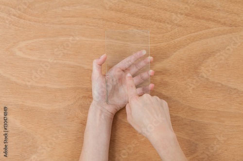 Hands pretending to use digital tablet © WavebreakmediaMicro