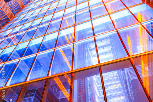 Modern skyscrapers glass wall in the evening