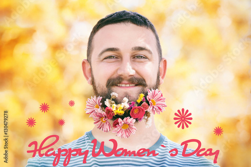 Handsome man with flowers i...