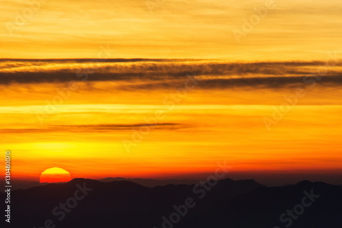Sunset with sun rays, sky with clouds and sun... © Worapoj