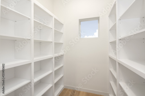 Large Closet with Built In Shelving in white