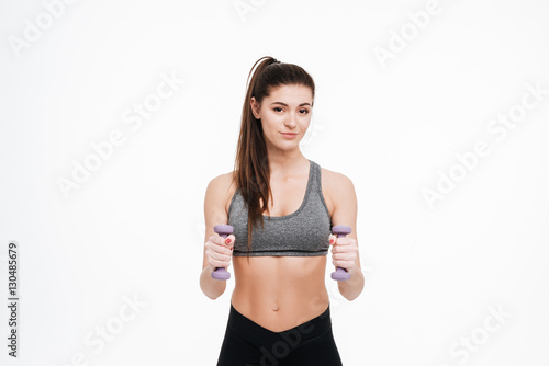 Smiling fitness woman workout with small dumbbells © Drobot Dean