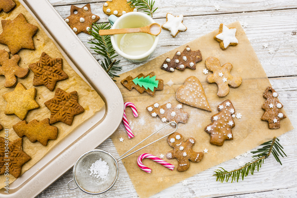 Fototapeta premium Homemade Christmas gingerbread cookies on wooden rustic background. 