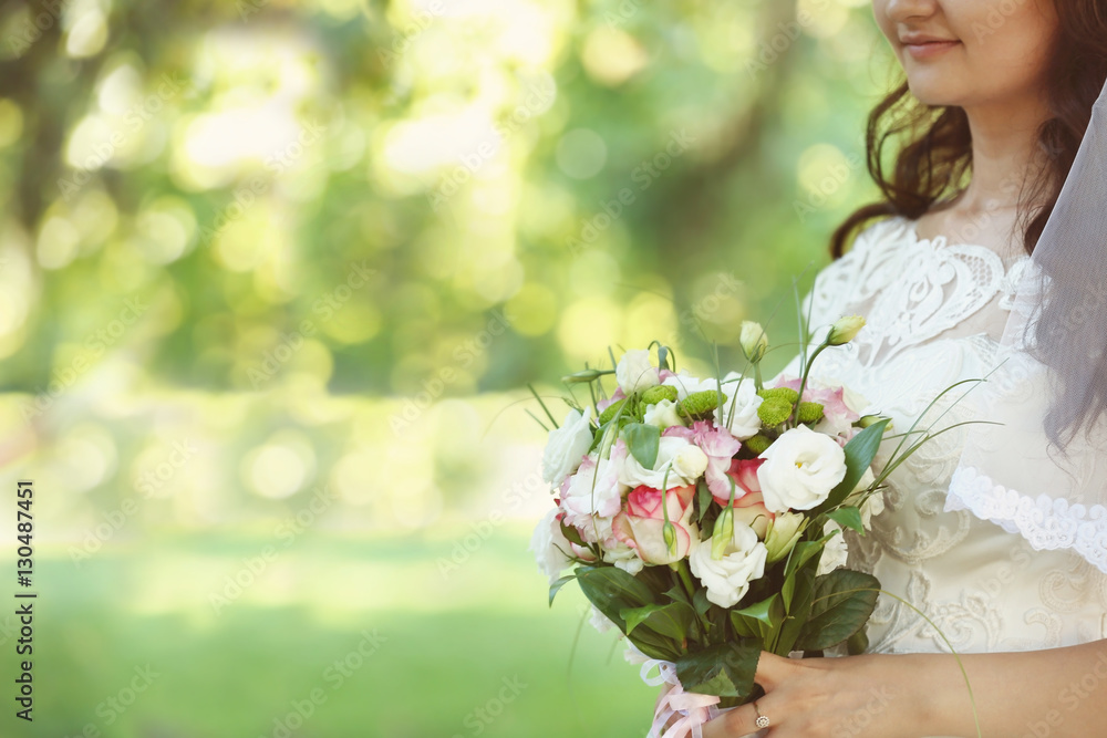 Bride with flower bouquet on her wedding day Bride with flower bouquet on her wedding day