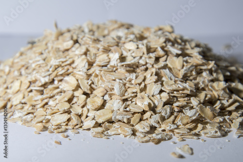 Oats scattered on the table. Bunting photographed in close-up.
