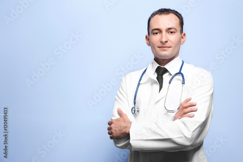 Practitioner with crossed h...