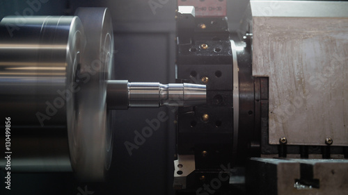 Rotated mechanism - automatic for machine processing of metal, industrial background, front view