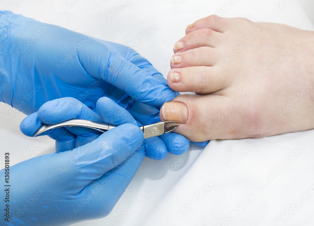 Fototapeta premium Process of pedicure at beauty salon