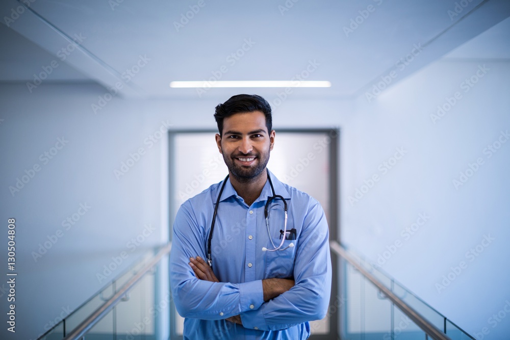Portrait of doctor standing with arms crossed Portrait of doctor standing with arms crossed