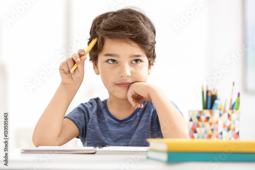 Cute little boy thinking ab...