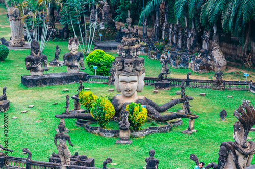 Buddha park in Vientiane, Laos. The landmark of ancient Buddhist stone statues and religious figures photo