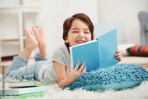 Cute little boy lying on th...