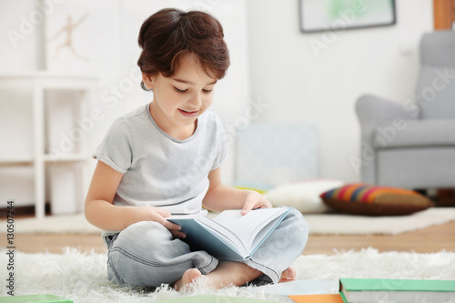 Cute little boy sitting on ...
