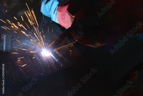 the welding spark light in close-up scene,the torch of welding machine