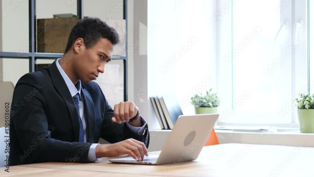 Black Businessman Waiting at Work, Watching Time Black Businessman Waiting at Work, Watching Time