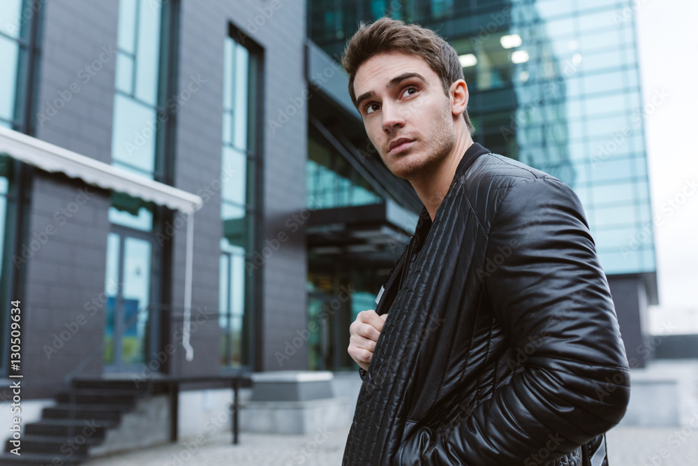 Serious Business man standing sideways Serious Business man standing sideways