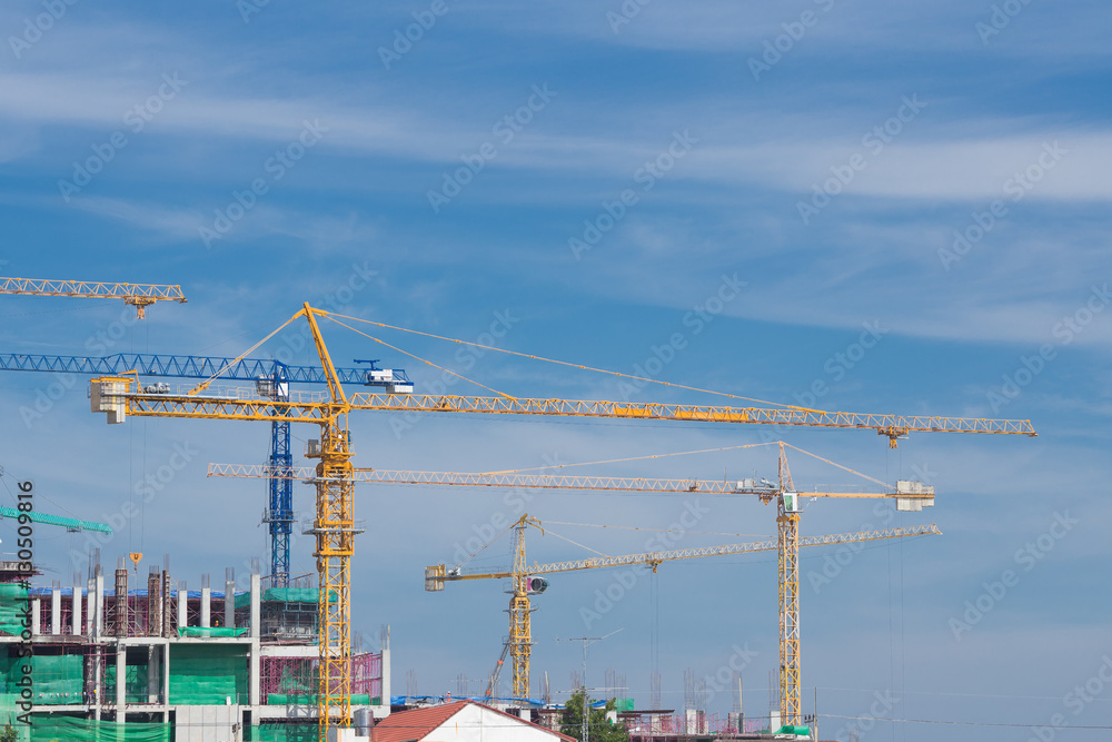 Industrial construction crane with sky background