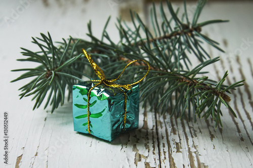 Colorful Christmas presents on old white wooden background