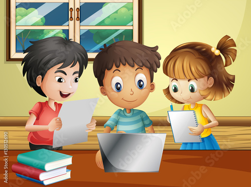 Three kids doing research on computer in the room