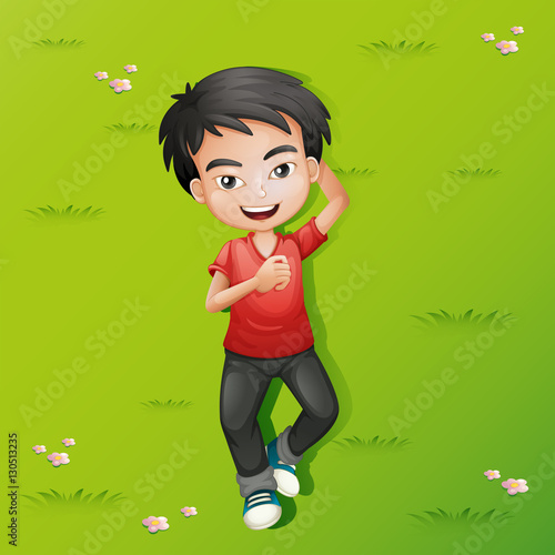 Little boy lying down on the grass