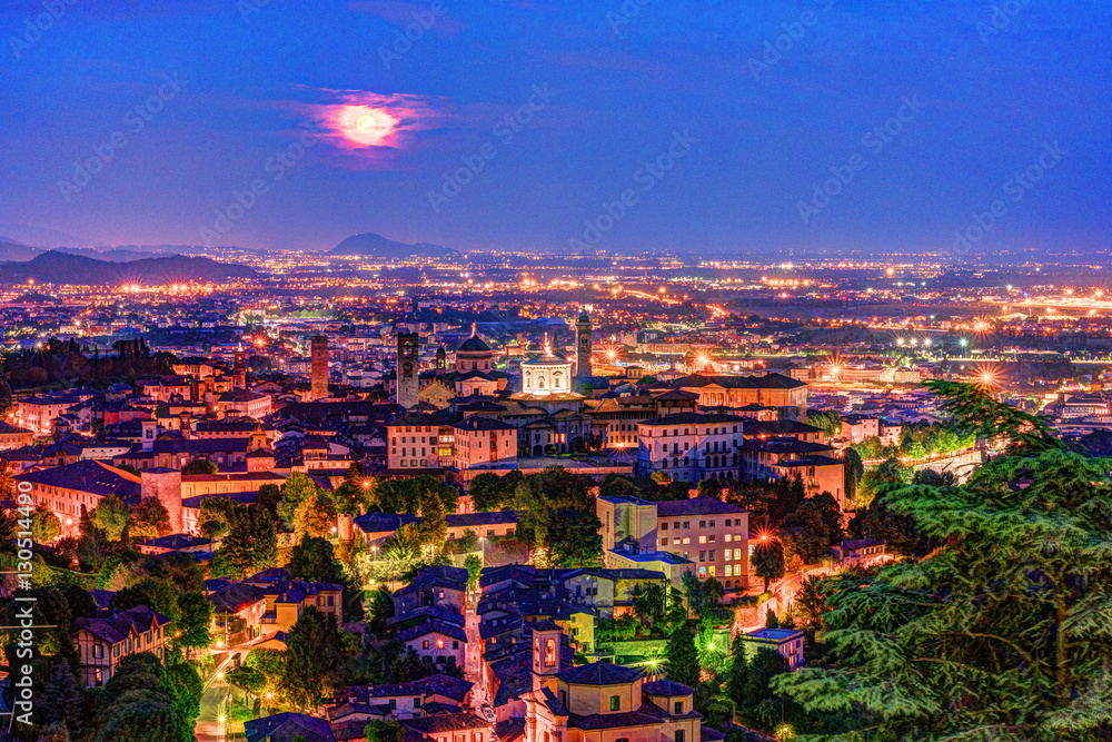 View at Old Town Citta Alta of Bergamo from San Vigilio Hill. Bergamo, Italy. Night view.
