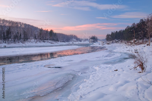Frozen river/Reflection of the sunset sky in a frozen river. Katun River, Mountain Altai, Siberia, Russia © George