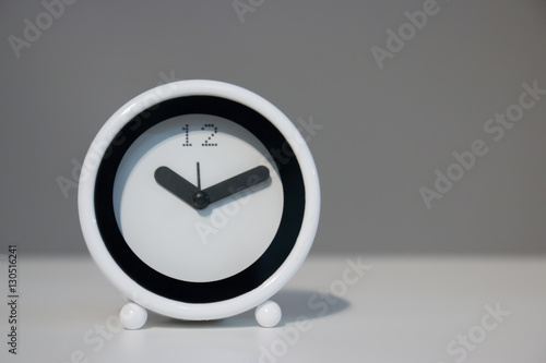 White Alarm clock on table with copy space