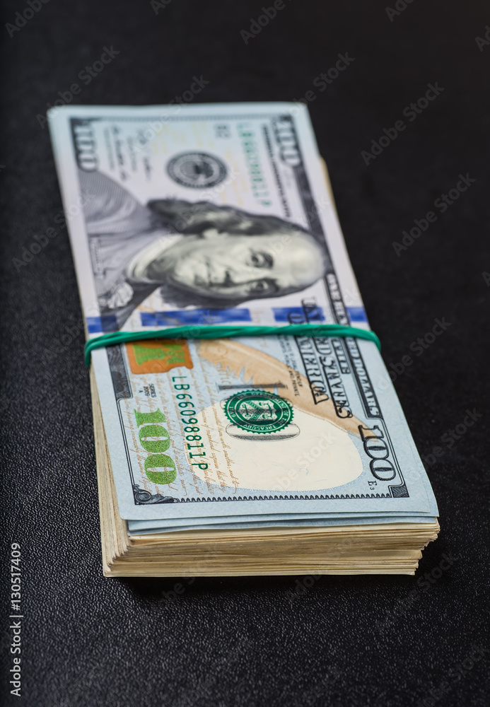 Stack of one hundred dollar bills close-up. Stack of one hundred dollar bills close-up.