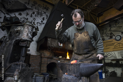Wallpaper Mural Blacksmith at work in his workshop Torontodigital.ca