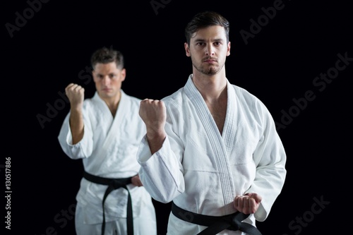 Two karate fighters performing karate stance