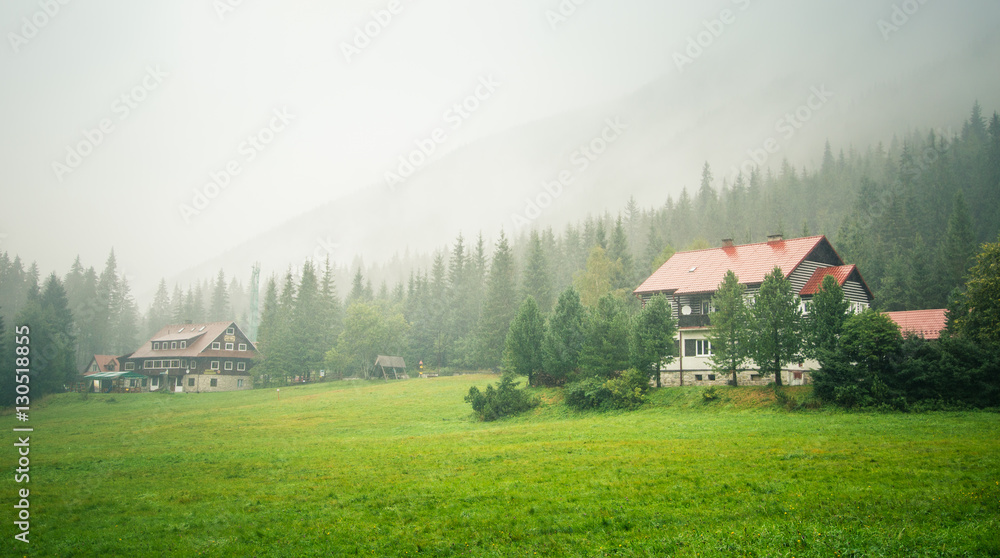 A beautiful mountain landscape in Tatry, Slovakia with a house A beautiful mountain landscape in Tatry, Slovakia with a house