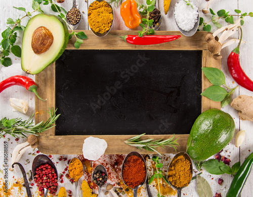 Various colorful spices on wooden table