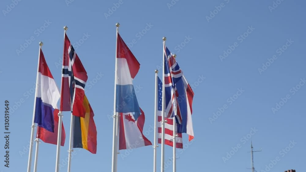 Slow motion of different nations symbols waving on white poles 1920X1080 HD footage - American and European flags mixed on the wind 1080p FullHD video Slow motion of different nations symbols waving on white poles 1920X1080 HD footage - American and European flags mixed on the wind 1080p FullHD video