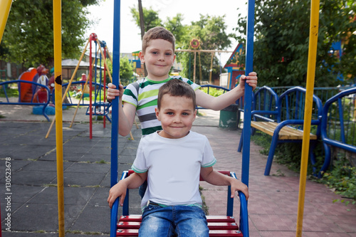 little boys on the playground © lozochka
