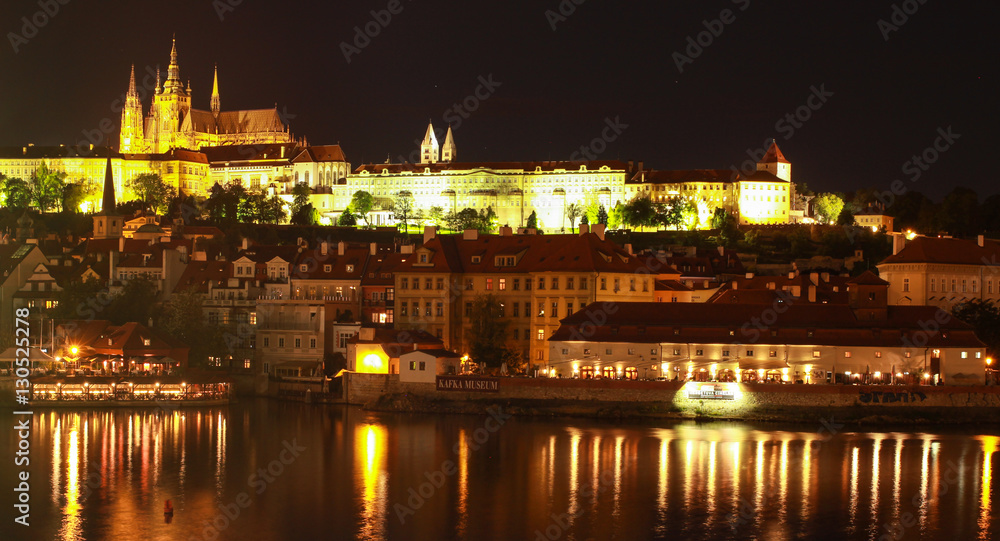 Night photo of St. Vitus Cathedral, Prague castle and the Vltava River