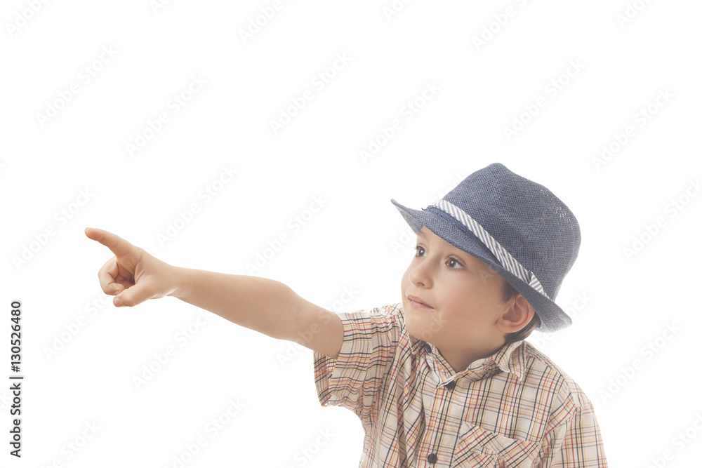 Caucasian kid with hat . Isolated on white background. Space for copy or other design.Astonished face.Pointing with his finger Caucasian kid with hat . Isolated on white background. Space for copy or other design.Astonished face.Pointing with his finger