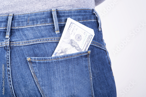 dollars sticking out of his pants pocket photo